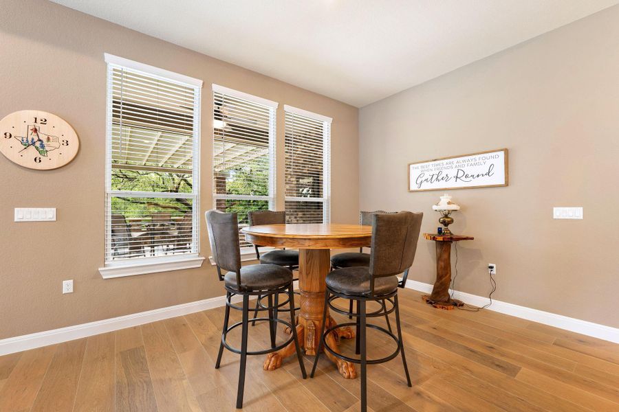 Hardwood floors and natural light from expansive windows create a welcoming space. Hardwood floors and natural light from expansive windows create a welcoming space.