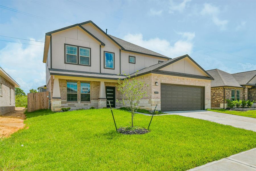 Front exterior of a new home in , Manvel, TX, highlighting curb appeal (Image 26). Front exterior of a new home in , Manvel, TX, highlighting curb appeal (Image 26).