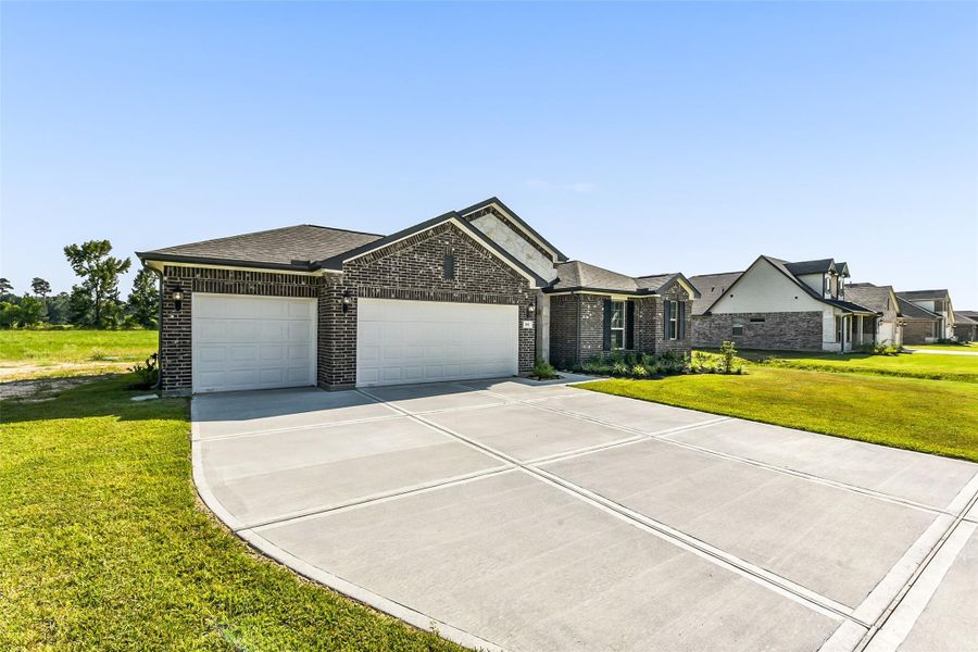 Front exterior of a new home in Barton Place, Cleveland, TX, highlighting curb appeal (Image 1). Front exterior of a new home in Barton Place, Cleveland, TX, highlighting curb appeal (Image 1).