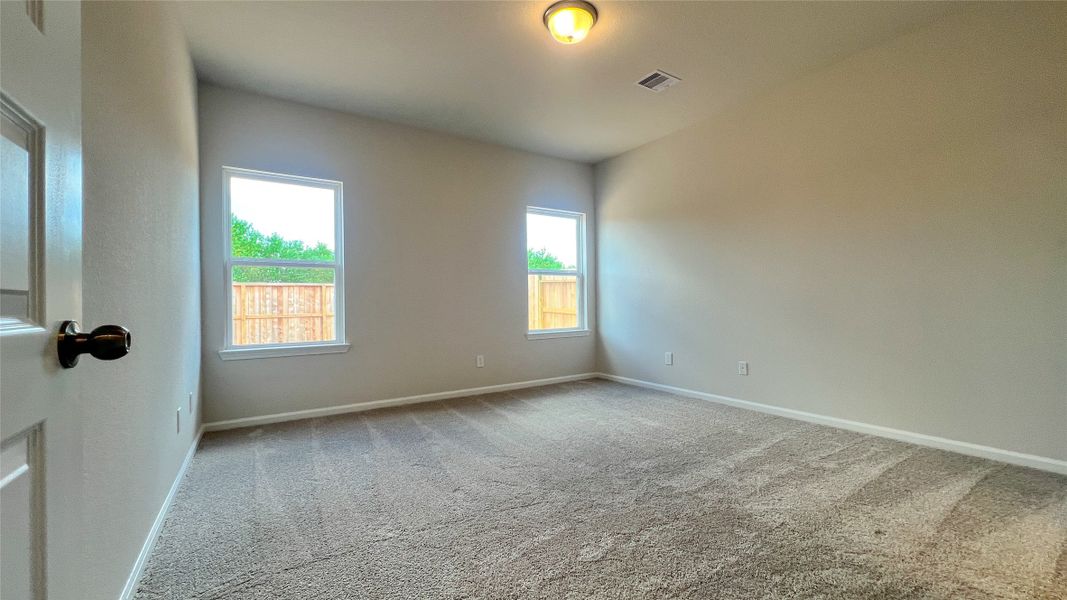 The Sparrow II- Primary Bedroom Suite. Sample floor plan image for illustration; upgrades, options, and colors may vary.