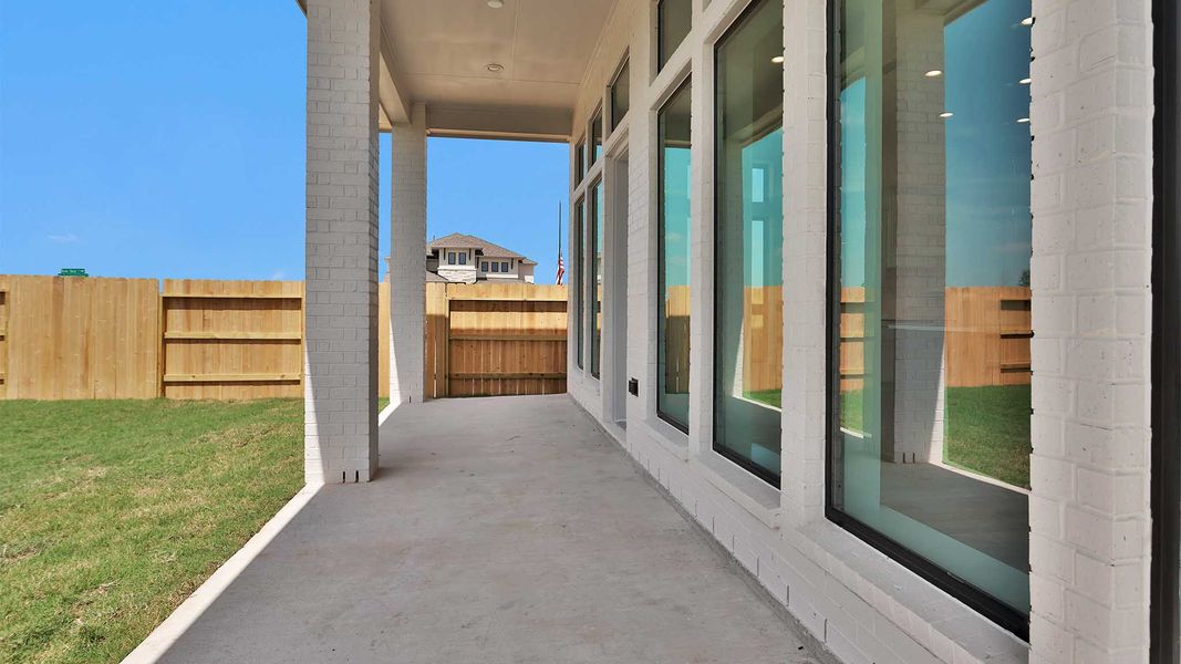 Exterior details and patio area of a home in Lakes of Cane Island, Katy (Image 3).