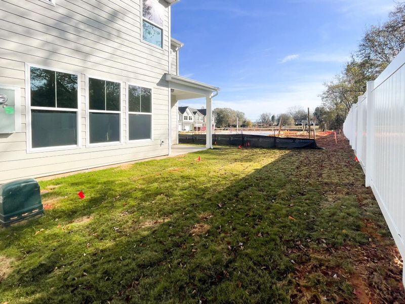 Exterior details and patio area of a home in Riverbrooke Townhomes, Simpsonville (Image 3).