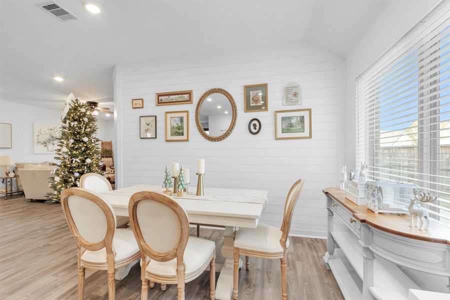 Elegant dining area with shiplap water feature