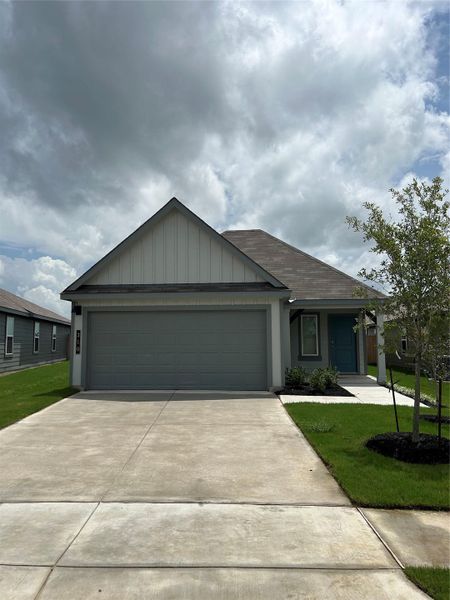 Front exterior of a new home in Cornerstone, Rockdale, TX, highlighting curb appeal (Image 2).