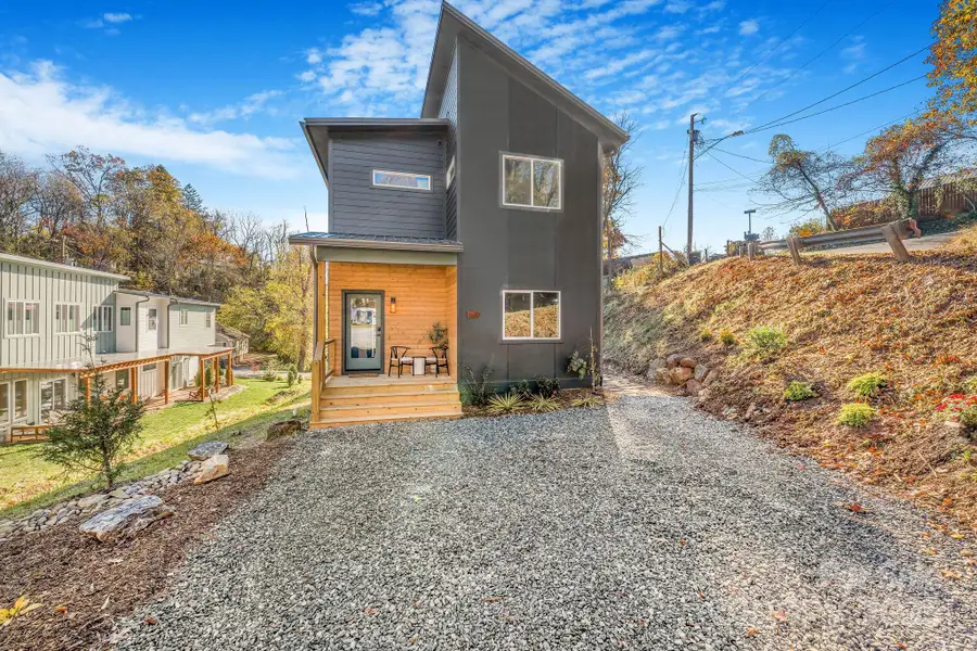 Front exterior of a new home in , Asheville, NC, highlighting curb appeal (Image 1).