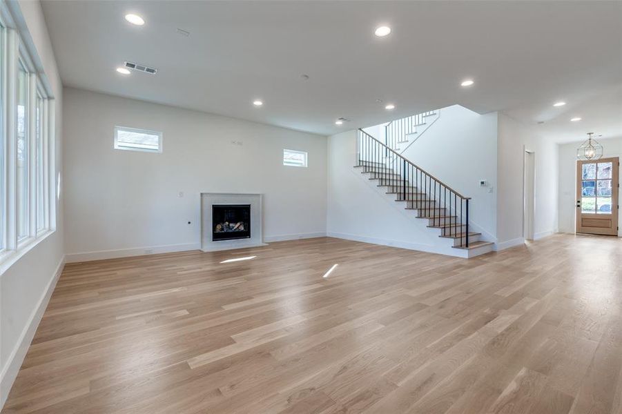 Unfurnished living room featuring light wood-type flooring