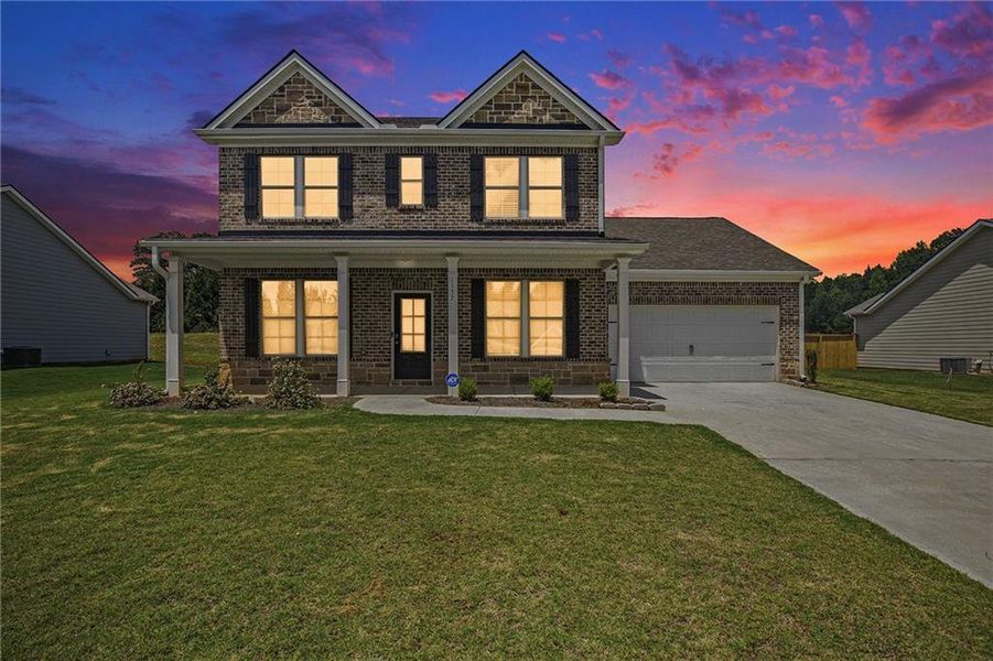 Front exterior of a new home in Vineyard Park, Griffin, GA, highlighting curb appeal (Image 17).