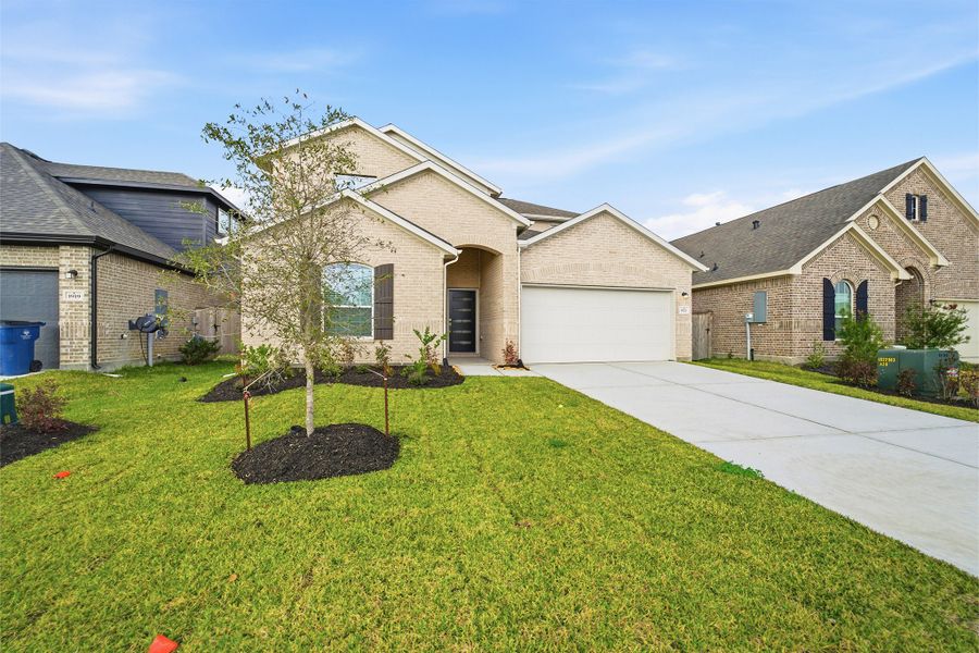 Front exterior of a new home in Windrose Green, Angleton, TX, highlighting curb appeal (Image 18).