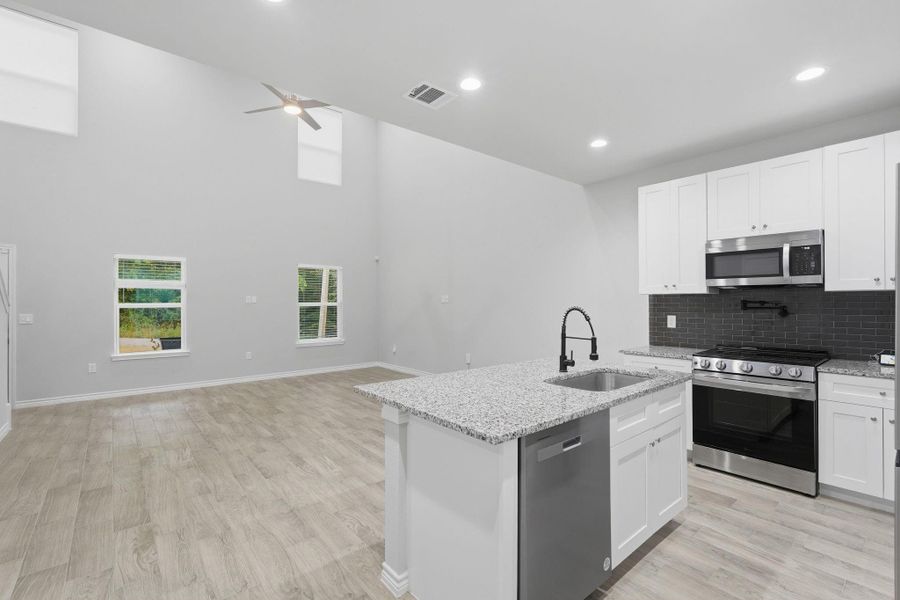 Furnished interior view inside a new home in Arrowhead Lakes, Willis (Image 8).