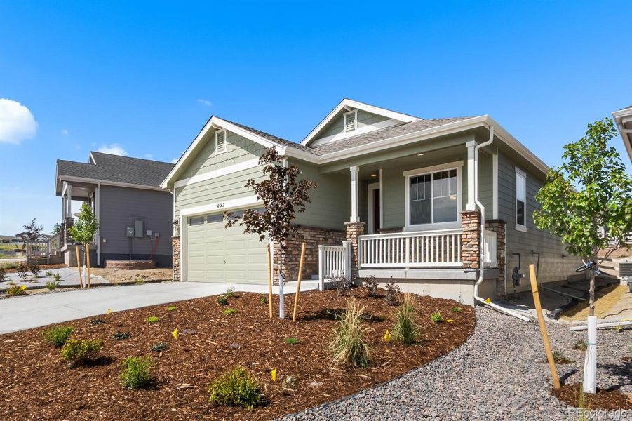 Front exterior of a new home in Rhyolite Ranch, Castle Rock, CO, highlighting curb appeal (Image 25).