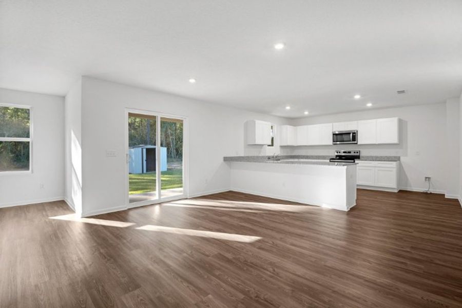 A large kitchen with white cabinets.