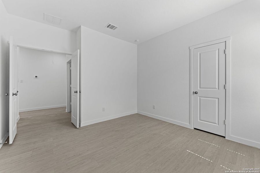 Spacious, unfurnished interior of a new home in Waterwheel: Coastline Collection, San Antonio (Image 17).