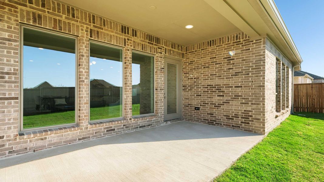 Exterior details and patio area of a home in Devonshire - Reserve 45', Forney (Image 2). Exterior details and patio area of a home in Devonshire - Reserve 45', Forney (Image 2).