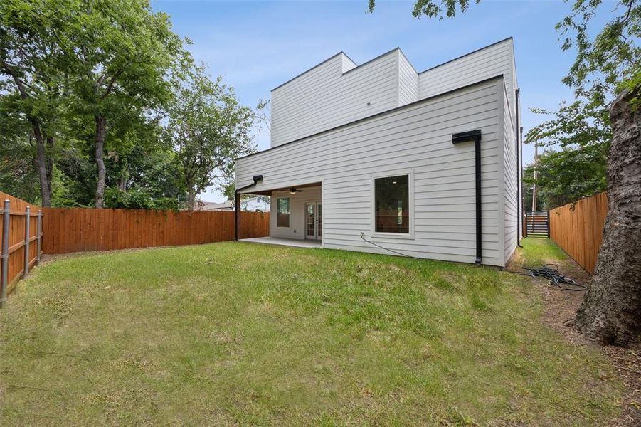 Rear view of house featuring a patio