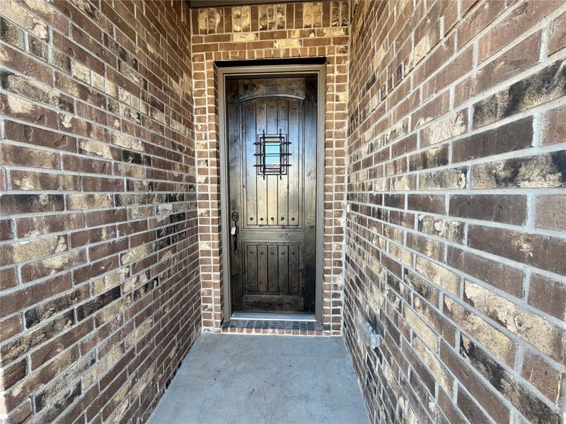 View of exterior entry featuring brick siding View of exterior entry featuring brick siding