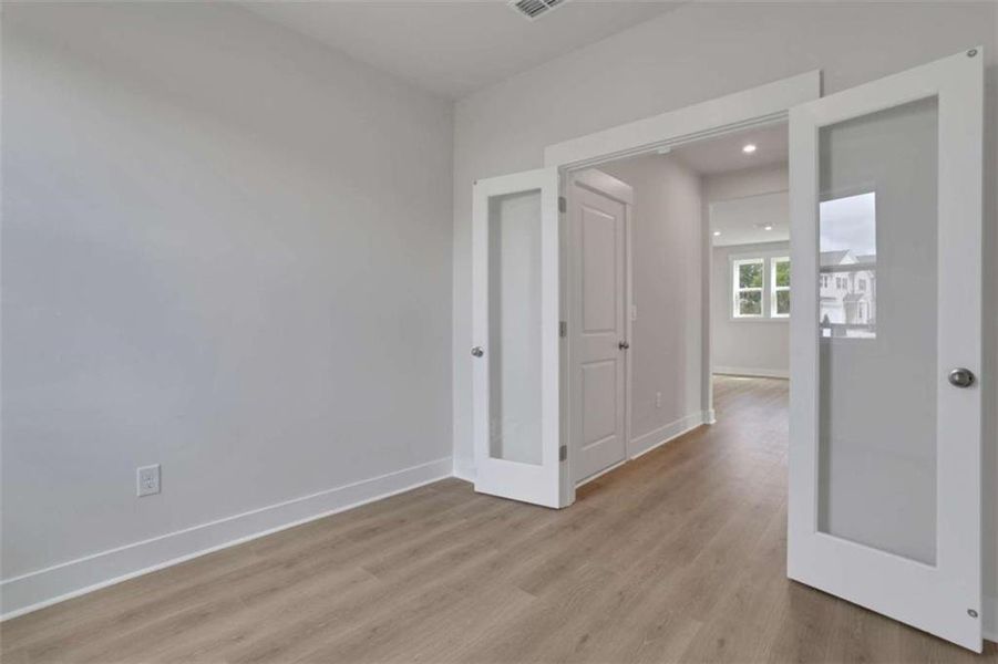 Spacious, unfurnished interior of a new home in The Paddocks at Doc Hughes, Buford (Image 35).