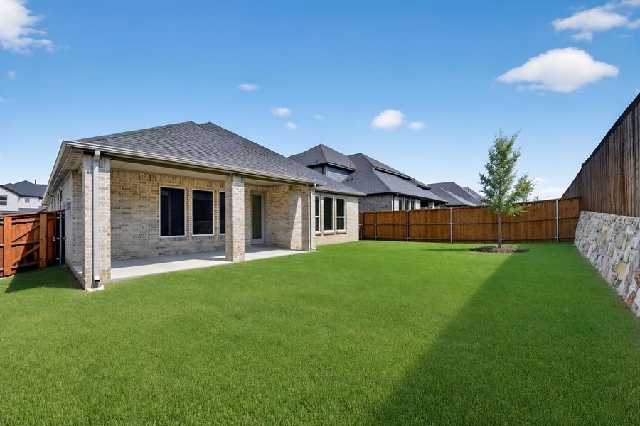 Exterior details and patio area of a home in South Oak, Lakewood Village (Image 19).