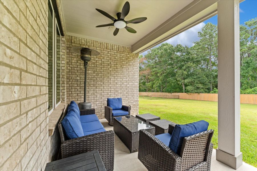 Exterior details and patio area of a home in Timber Hollow, Magnolia (Image 25).