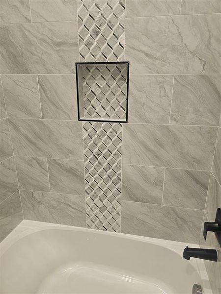 Bathroom with tiled shower / bath