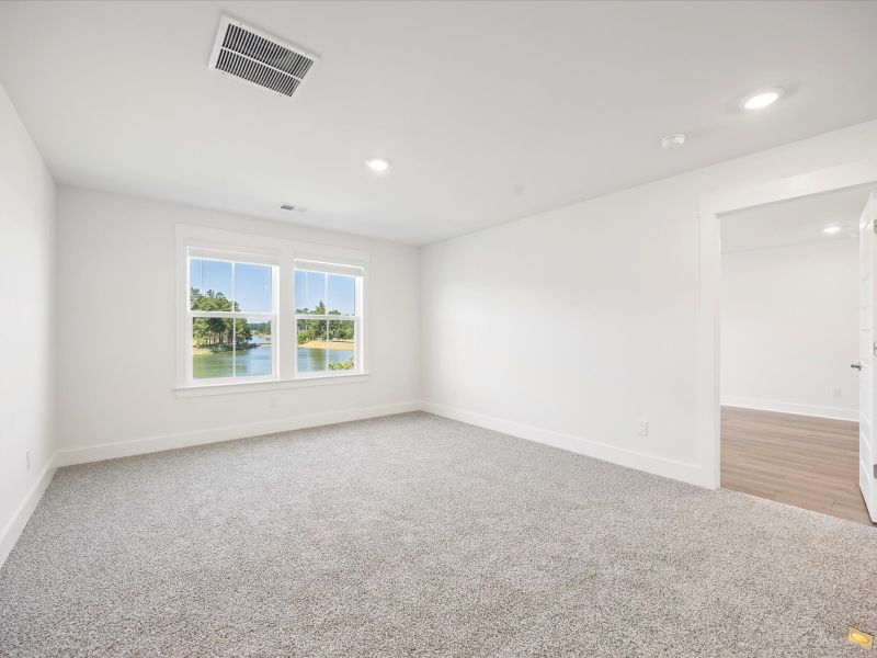 Spacious, unfurnished interior of a new home in The Coves at Lakes of Cane Bay, Summerville (Image 18). Spacious, unfurnished interior of a new home in The Coves at Lakes of Cane Bay, Summerville (Image 18).
