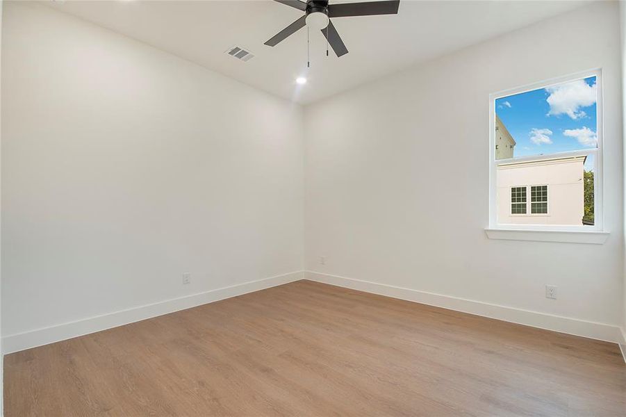 Spare room featuring light wood-type flooring, recessed lighting, and ceiling fan