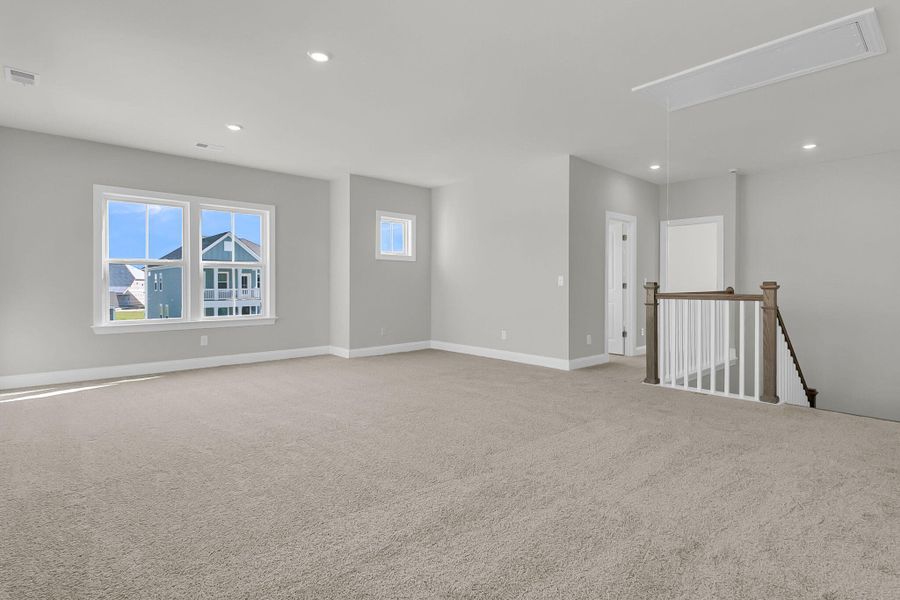 Spacious, unfurnished interior of a new home in Tidewater at Lakes of Cane Bay, Summerville (Image 21).