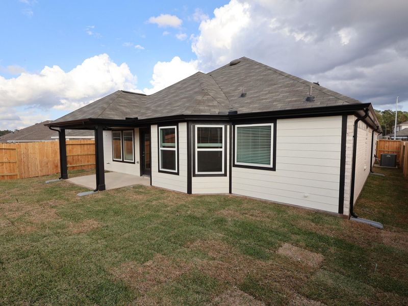 Exterior details and patio area of a home in Magnolia Ridge, Magnolia (Image 21).