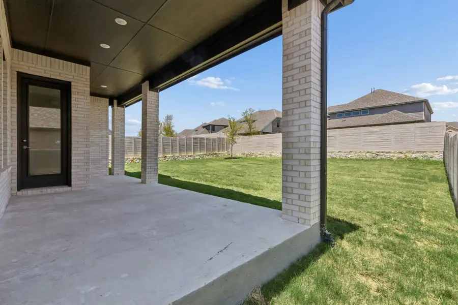 Exterior details and patio area of a home in Painted Tree Lakeside, McKinney (Image 4).