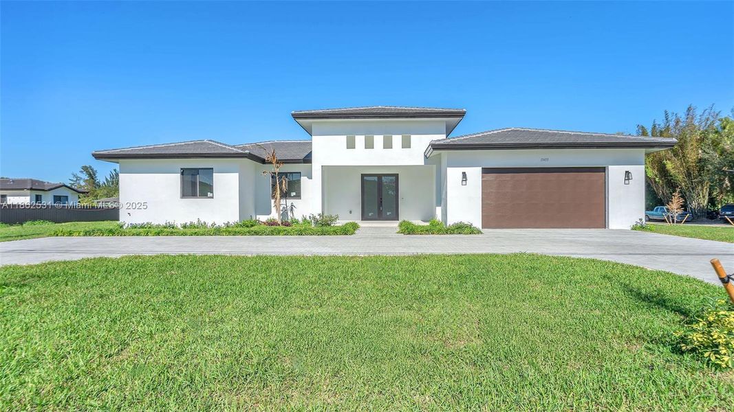 Front exterior of a new home in , Miami, FL, highlighting curb appeal (Image 25).