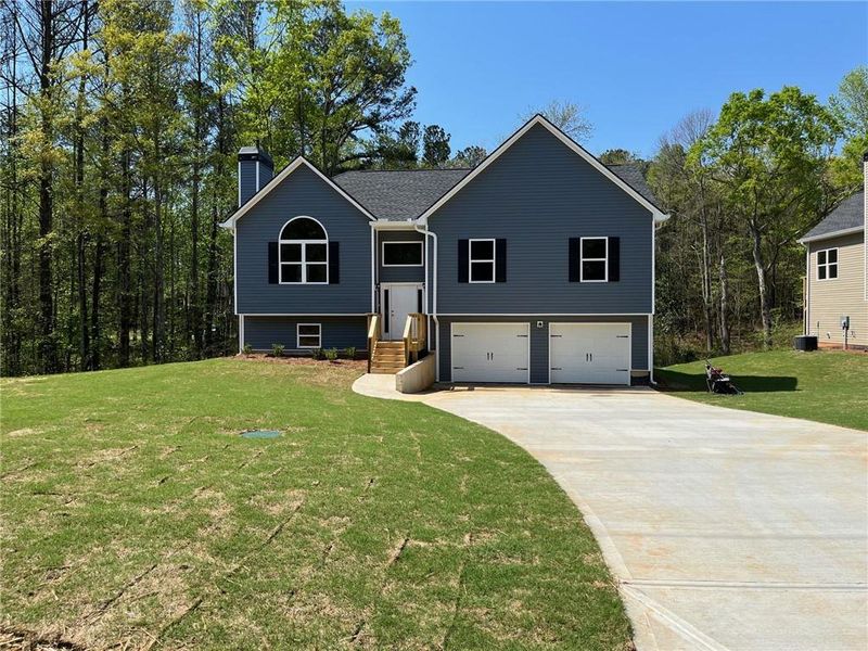 Front exterior of a new home in , Dallas, GA, highlighting curb appeal (Image 2). Front exterior of a new home in , Dallas, GA, highlighting curb appeal (Image 2).