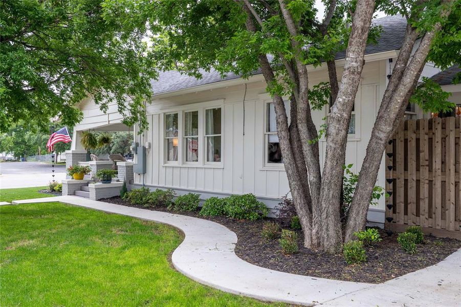 White siding exterior with a dark gray roof