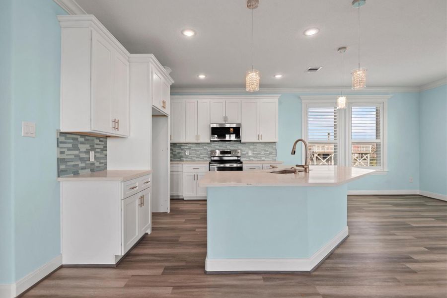 Nice island kitchen with breakfast bar.