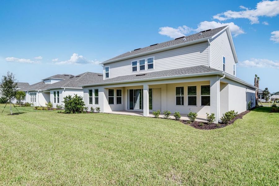 Exterior details and patio area of a home in Ardisia Park, New Smyrna Beach (Image 19).