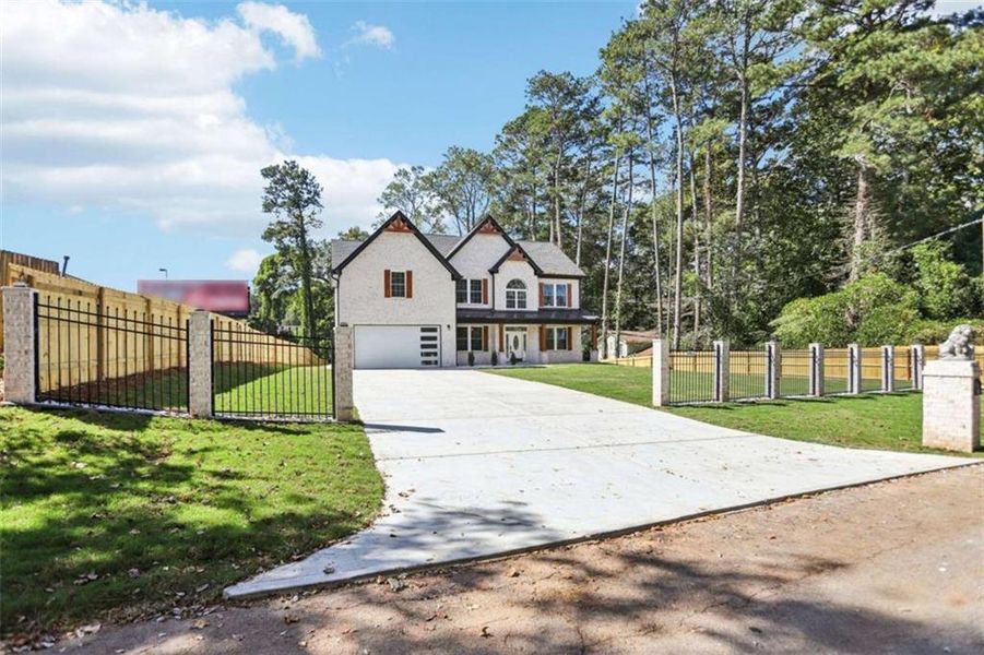 Front exterior of a new home in , Lilburn, GA, highlighting curb appeal (Image 33). Front exterior of a new home in , Lilburn, GA, highlighting curb appeal (Image 33).