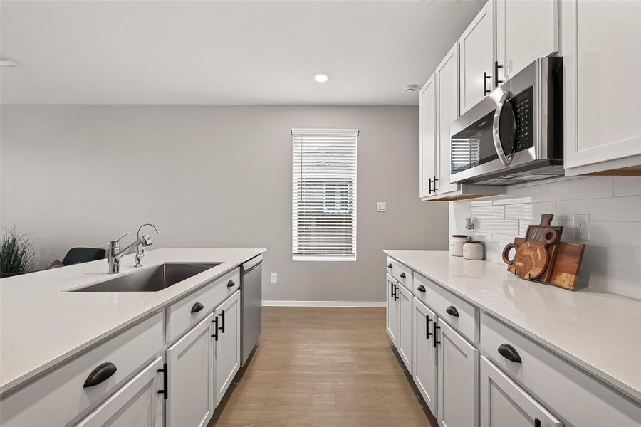 Guest suite kitchen offering ample cabinetry, generous counter space, and stainless steel appliances. Guest suite kitchen offering ample cabinetry, generous counter space, and stainless steel appliances.