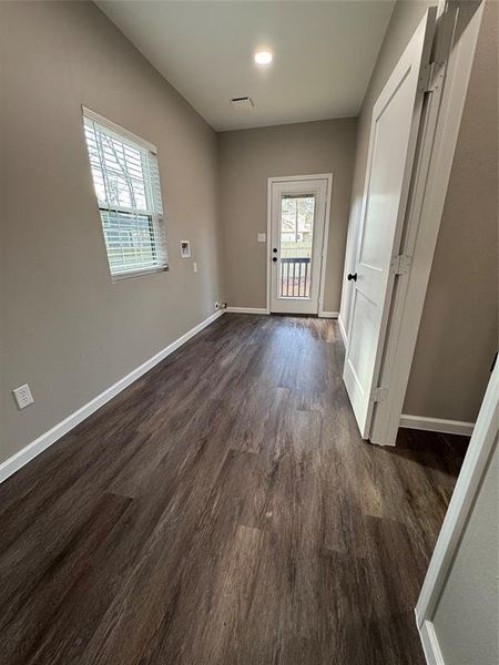 Utility room has plenty of space for wash/dryer, extra freezer and could double as a mudroom with exterior entrance from the drive way