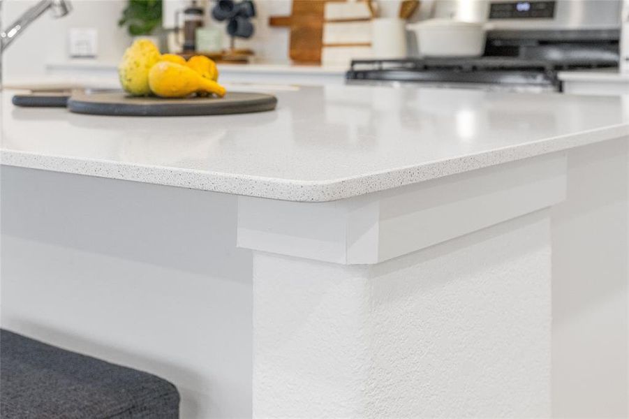 Interior details with light countertops and stove