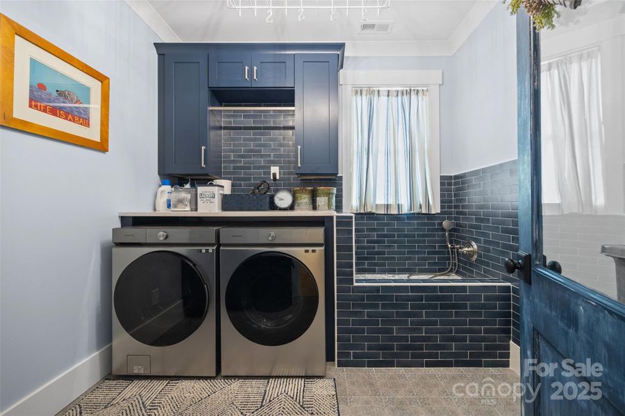 laundry room with built ins and dog wash/boot wash