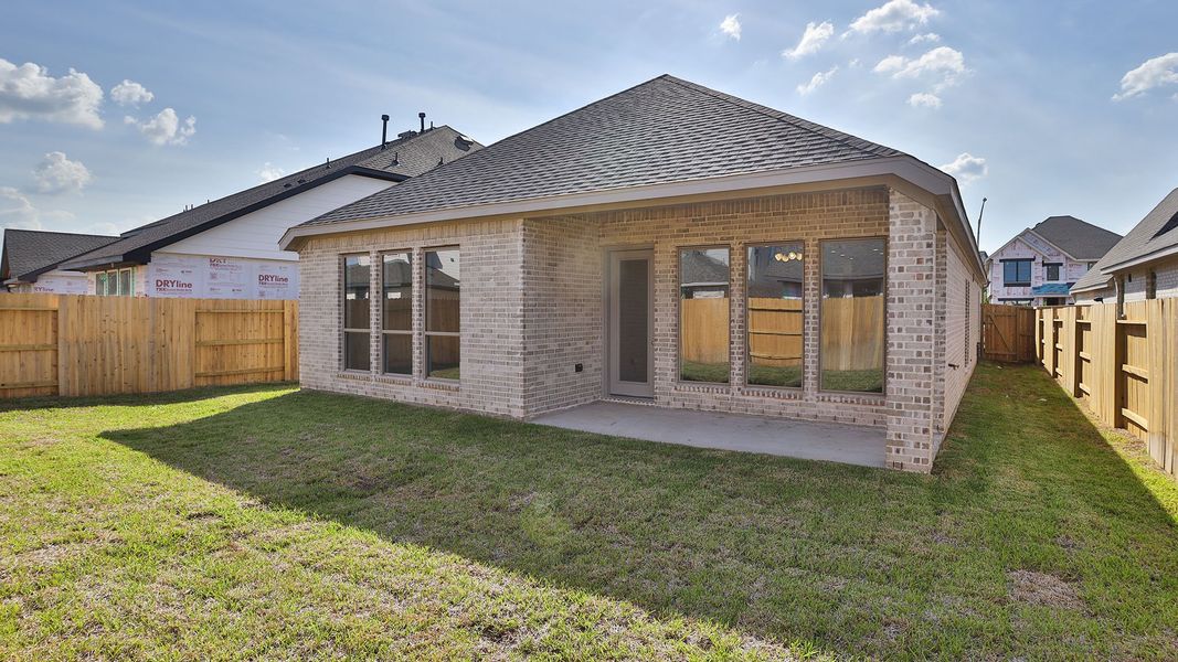 Exterior details and patio area of a home in Grand Central Park, Conroe (Image 2).