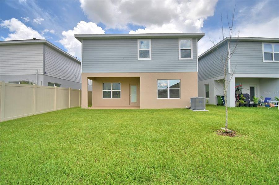 Front exterior of a new home in Villamar, Winter Haven, FL, highlighting curb appeal (Image 9). Front exterior of a new home in Villamar, Winter Haven, FL, highlighting curb appeal (Image 9).