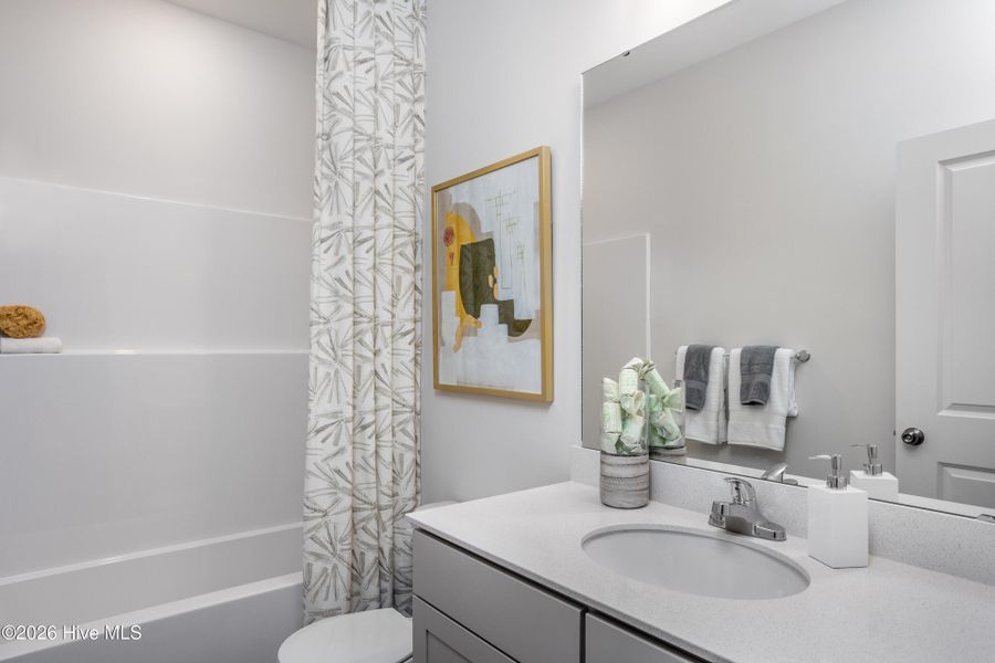 Furnished interior view inside a new home in Coastal Haven Townes, Leland (Image 19).