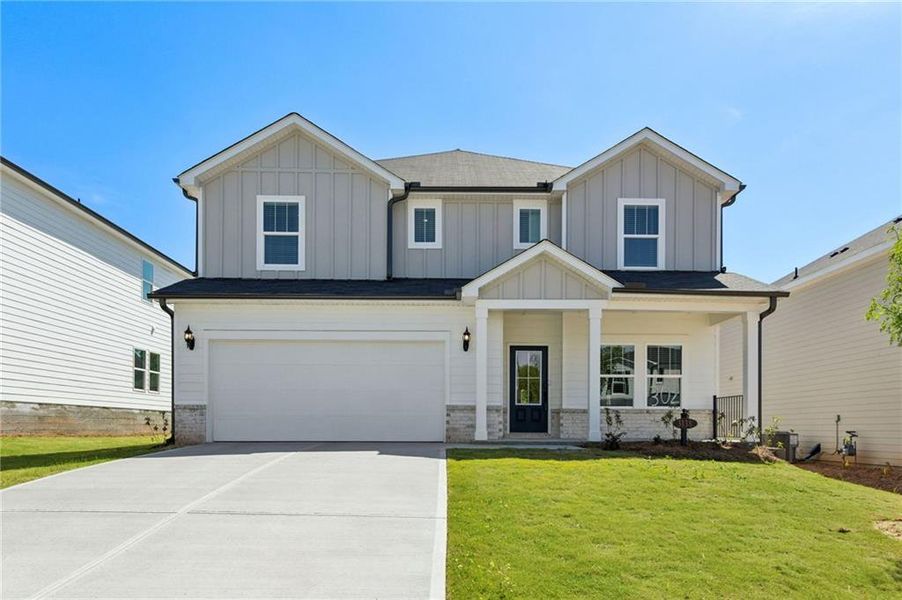 Front exterior of a new home in Vines at Mill Creek - Estate Series, Braselton, GA, highlighting curb appeal (Image 28).