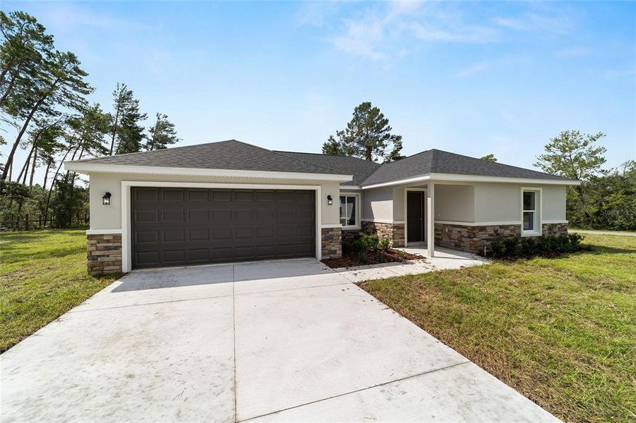 Front exterior of a new home in , Dunnellon, FL, highlighting curb appeal (Image 2). Front exterior of a new home in , Dunnellon, FL, highlighting curb appeal (Image 2).