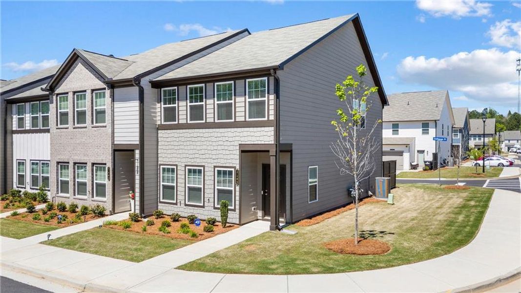 Front exterior of a new home in Laurelwood, Douglasville, GA, highlighting curb appeal (Image 28).