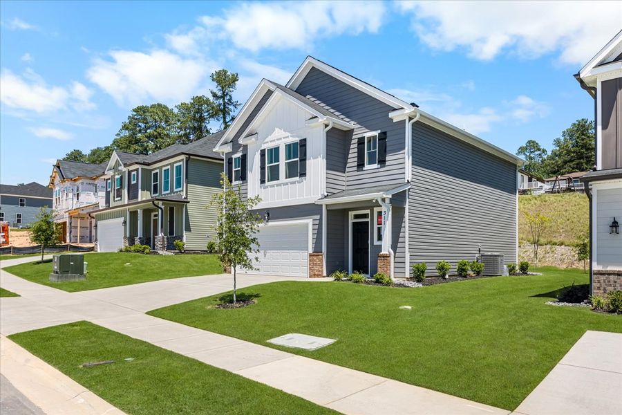 Front exterior of a new home in Forrest Bluff, North Augusta, SC, highlighting curb appeal (Image 19). Front exterior of a new home in Forrest Bluff, North Augusta, SC, highlighting curb appeal (Image 19).
