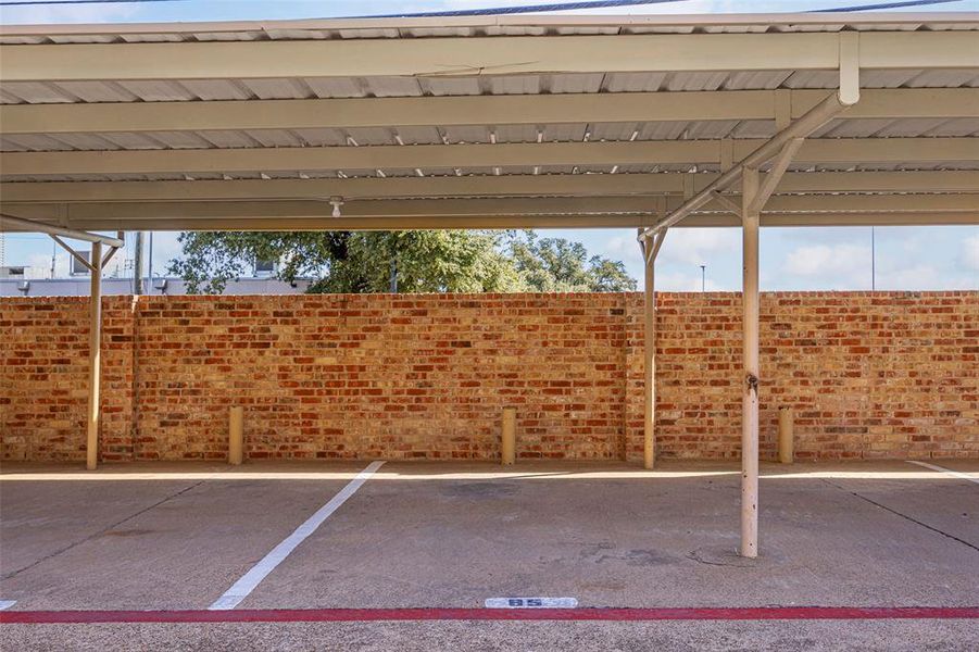 View of vehicle parking with a carport