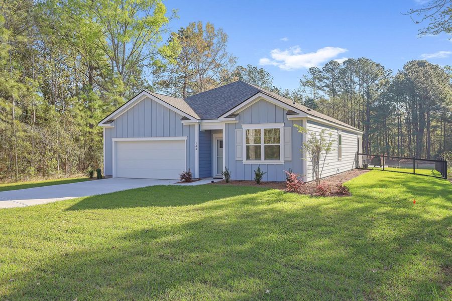 Front exterior of a new home in Rivers Reach, Yemassee, SC, highlighting curb appeal (Image 21). Front exterior of a new home in Rivers Reach, Yemassee, SC, highlighting curb appeal (Image 21).