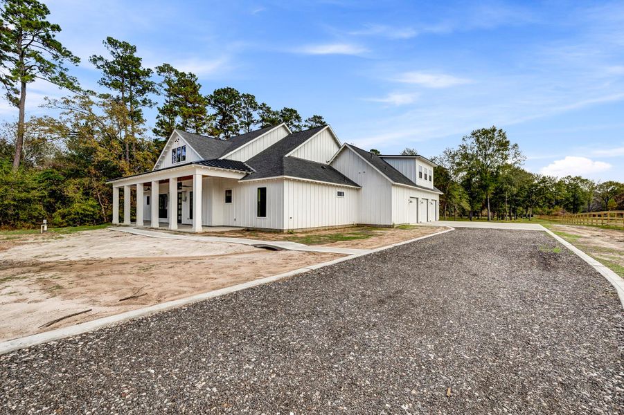 Front exterior of a new home in , Magnolia, TX, highlighting curb appeal (Image 1). Front exterior of a new home in , Magnolia, TX, highlighting curb appeal (Image 1).