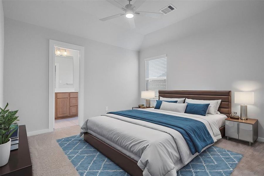 Secondary bedroom features plush carpet, custom paint, ceiling fan with lighting and a large window with privacy blinds, and private access to secondary bathroom.