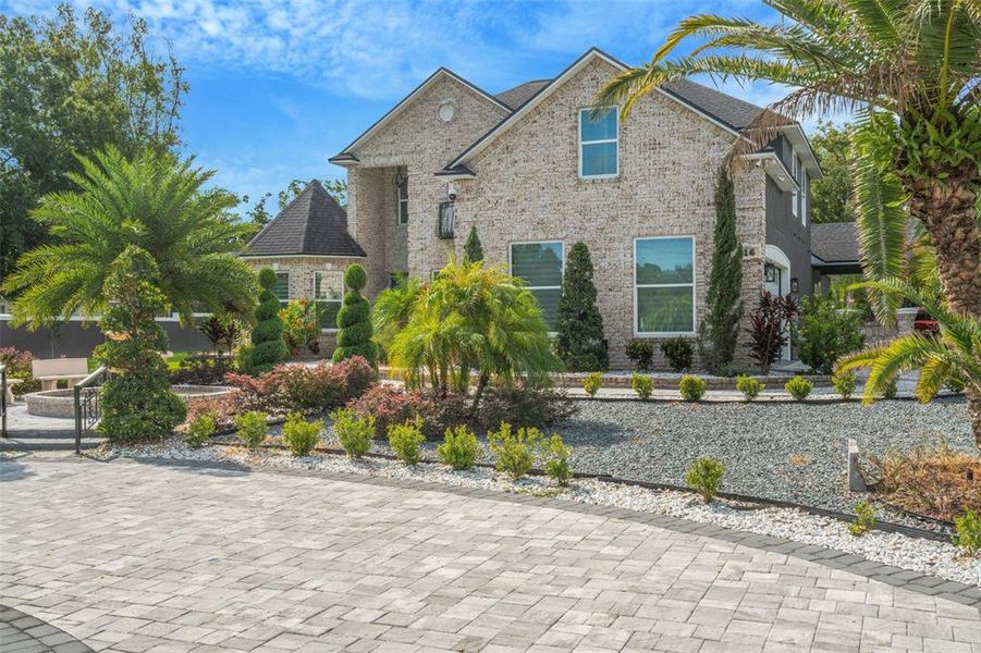Front exterior of a new home in , Lakeland, FL, highlighting curb appeal (Image 24). Front exterior of a new home in , Lakeland, FL, highlighting curb appeal (Image 24).